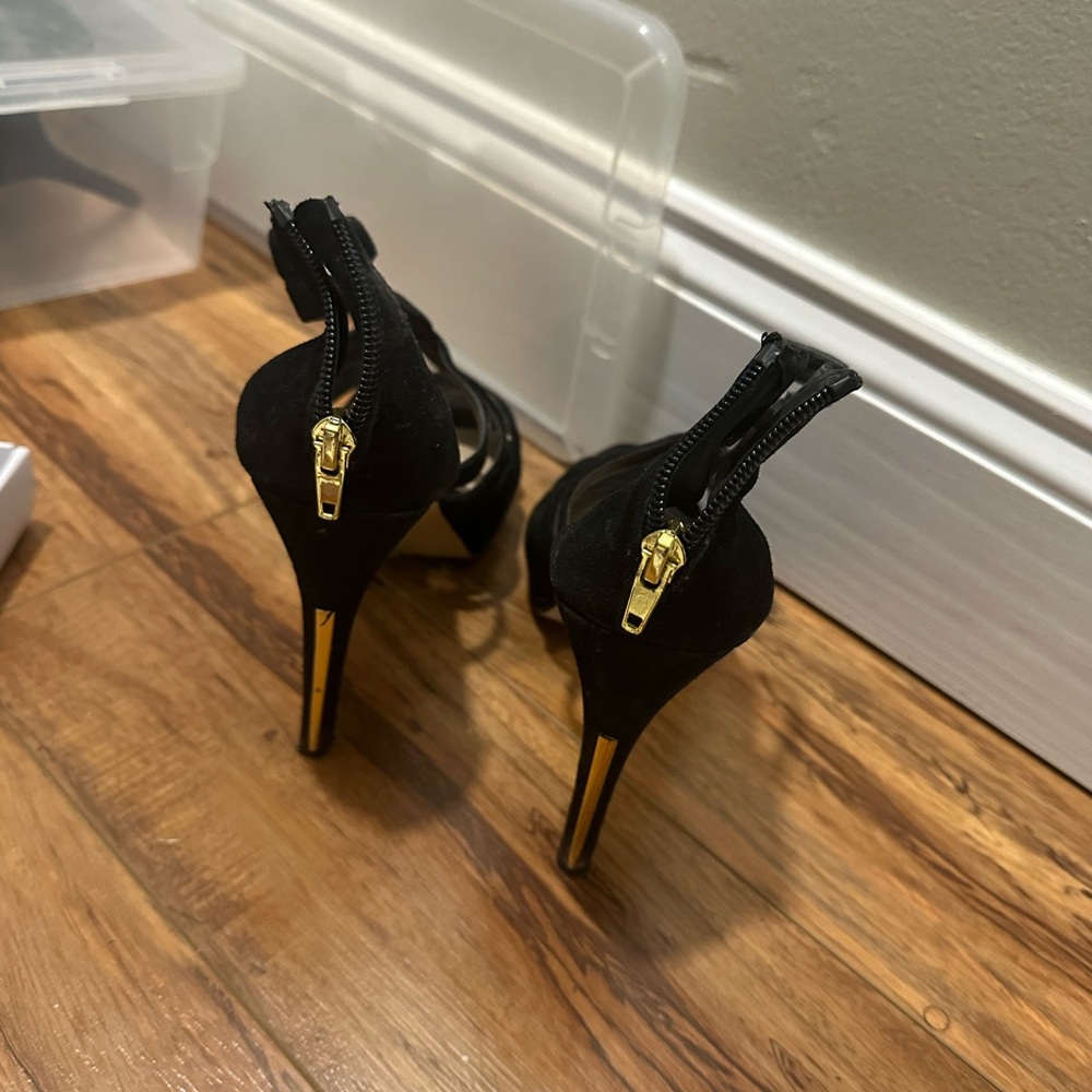 Black shoes with gold heel